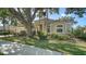 Beautiful one-story home with well-maintained landscaping, a tile roof, and lush greenery, providing a welcoming curb appeal at 241 Willow Bend Way, Osprey, FL 34229