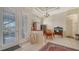Inviting foyer features tile flooring, an elegant chandelier, and plenty of natural light, enhancing the home's appeal at 241 Willow Bend Way, Osprey, FL 34229