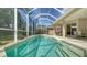 Screened-in pool and patio area with chairs for outdoor living and entertaining at 241 Willow Bend Way, Osprey, FL 34229