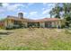 Spacious backyard with mature trees, offering plenty of room for outdoor activities and relaxation at 2417 6Th Avenue E Dr, Bradenton, FL 34208