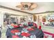 Spacious bedroom with ceiling fan, mirrored wall, a fireplace and furniture at 2417 6Th Avenue E Dr, Bradenton, FL 34208