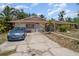 Charming single-story home featuring a spacious driveway and well-maintained front yard with mature trees at 2417 6Th Avenue E Dr, Bradenton, FL 34208