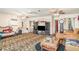 Spacious living room with unique tiger print carpet and comfortable seating at 2417 6Th Avenue E Dr, Bradenton, FL 34208