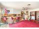 Open concept living room featuring a bar counter, ceiling fan, and vintage furniture at 2417 6Th Avenue E Dr, Bradenton, FL 34208