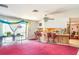 Open living room area featuring a breakfast bar and sliding glass doors for ample natural light at 2417 6Th Avenue E Dr, Bradenton, FL 34208