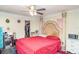 Bright bedroom with a ceiling fan, large bed, closet and natural light at 2417 6Th Avenue E Dr, Bradenton, FL 34208