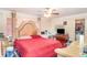 Cozy bedroom featuring a ceiling fan, a large bed and lots of light at 2417 6Th Avenue E Dr, Bradenton, FL 34208