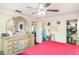 Bedroom featuring a dresser, ceiling fan, and a doorway to another room at 2417 6Th Avenue E Dr, Bradenton, FL 34208