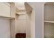 Spacious walk-in closet offering ample storage with shelving and hanging rods at 2819 Swifton Dr # 9, Sarasota, FL 34231