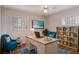 Well-lit home office features a large desk, comfortable chairs, and stylish decor at 2819 Swifton Dr # 9, Sarasota, FL 34231