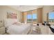Inviting bedroom with balcony access and bright decor at 3080 Grand Bay Blvd # 533, Longboat Key, FL 34228