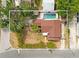 An aerial view showcases this cozy home and its private backyard pool with a spa, creating a perfect outdoor retreat at 316 29Th W St, Bradenton, FL 34205