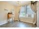 Neutral bedroom featuring wood floors, a desk and a chandelier at 316 29Th W St, Bradenton, FL 34205
