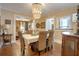 A dining room with hardwood floors, dining table and a decorative chandelier at 316 29Th W St, Bradenton, FL 34205