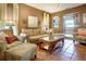 Inviting living room with comfortable seating and terracotta tile flooring offers a cozy and stylish space at 316 29Th W St, Bradenton, FL 34205