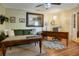 Cozy living room with hardwood floors, desk, and a comfortable sofa at 316 29Th W St, Bradenton, FL 34205