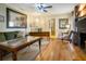 Comfortable living room with hardwood floors, fireplace, and a sitting area at 316 29Th W St, Bradenton, FL 34205