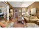 Cozy living room with terracotta tile floors, neutral walls, and abundant natural light offers a relaxing retreat at 316 29Th W St, Bradenton, FL 34205