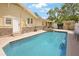 A sparkling pool with a brick deck is the focal point of the backyard, complete with a hot tub and home exterior at 316 29Th W St, Bradenton, FL 34205