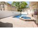 The backyard is a private oasis, featuring a beautiful pool, hot tub, brick patio, and a tall privacy fence at 316 29Th W St, Bradenton, FL 34205
