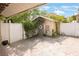 A garden shed with an overgrown vine sits along a brick-paved alleyway at 316 29Th W St, Bradenton, FL 34205