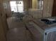 Cozy dining room with a round table, comfortable seating, and built-in cabinets for ample storage at 320 Tropic Dr, Osprey, FL 34229