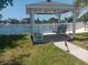 Picturesque gazebo nestled near the water's edge, providing a serene spot for relaxation and community gatherings at 320 Tropic Dr, Osprey, FL 34229
