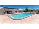 Sparkling community pool featuring clean blue waters and brick paver deck, inviting relaxation and recreation at 320 Tropic Dr, Osprey, FL 34229