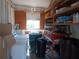 Functional utility room with washer, storage and ample shelving at 320 Tropic Dr, Osprey, FL 34229