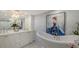 Elegant bathroom featuring a standalone tub, stylish finishes, and a double vanity at 340 Gulf Of Mexico Dr # 136, Longboat Key, FL 34228