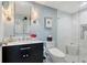 Updated bathroom with black vanity, marble countertop, and a glass-enclosed shower at 340 Gulf Of Mexico Dr # 136, Longboat Key, FL 34228