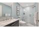 Bathroom featuring marble countertops, modern fixtures, and a glass-enclosed shower at 340 Gulf Of Mexico Dr # 136, Longboat Key, FL 34228