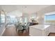 Light-filled dining room adjacent to living room and kitchen with stunning ocean views at 340 Gulf Of Mexico Dr # 136, Longboat Key, FL 34228