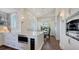 Well-lit kitchen area with stainless steel appliances, marble countertops, and wood floors at 340 Gulf Of Mexico Dr # 136, Longboat Key, FL 34228