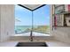 Bay view from kitchen sink and marble countertop, bright natural light, and stainless steel faucet at 340 Gulf Of Mexico Dr # 136, Longboat Key, FL 34228
