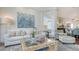 Living room showcasing comfortable seating and stylish decor with water views at 340 Gulf Of Mexico Dr # 136, Longboat Key, FL 34228