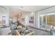 Open living area features a comfortable seating area and water views at 340 Gulf Of Mexico Dr # 136, Longboat Key, FL 34228