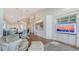 Bright living room with a comfortable chair, hardwood floors, and an open floor plan with elegant decor at 340 Gulf Of Mexico Dr # 136, Longboat Key, FL 34228