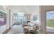 Inviting living room with skylights, fireplace, and floor-to-ceiling windows offering stunning water views at 340 Gulf Of Mexico Dr # 136, Longboat Key, FL 34228