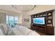 Elegant bedroom with a view, offering built-in shelving and decor at 340 Gulf Of Mexico Dr # 136, Longboat Key, FL 34228
