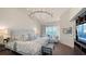 Luxurious main bedroom suite featuring a serene ocean view, stylish lighting, and contemporary furnishings at 340 Gulf Of Mexico Dr # 136, Longboat Key, FL 34228