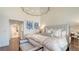 Cozy main bedroom with modern decor, hardwood floors, and tranquil aesthetics at 340 Gulf Of Mexico Dr # 136, Longboat Key, FL 34228