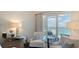 Comfortable seating area with ocean views, mirrored side table, and bright natural light at 340 Gulf Of Mexico Dr # 136, Longboat Key, FL 34228