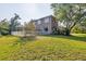 Expansive backyard showcases a screened pool area and lush greenery, ideal for Gathering gatherings and outdoor enjoyment at 3905 Trentwood Pl, Sarasota, FL 34243