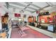 This garage features custom tool organization and work benches for car maintenance and projects at 3905 Trentwood Pl, Sarasota, FL 34243