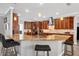 A spacious kitchen featuring warm wood cabinets, a large island, and granite countertops at 3905 Trentwood Pl, Sarasota, FL 34243
