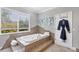 Granite clad jacuzzi soaking tub with a window view, along with gray colored walls and tile flooring at 3905 Trentwood Pl, Sarasota, FL 34243