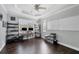 Home office with hardwood floors, ceiling fan, a large window, and a whiteboard at 3905 Trentwood Pl, Sarasota, FL 34243