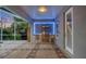 Outdoor kitchen with stainless steel grill, modern lighting, and ample counter space at 3905 Trentwood Pl, Sarasota, FL 34243