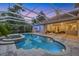 Screened pool area featuring a swimming pool, hot tub, covered patio and wet bar at 3905 Trentwood Pl, Sarasota, FL 34243